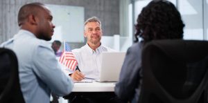 Couple meeting with immigration consultant for green card after consulting with Katy Green Card Lawyer.
